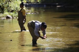 Picture of two girls testing water - Environmental Science and Water Quality