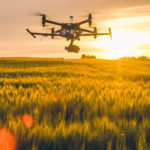 Picture of a drone flying above a field