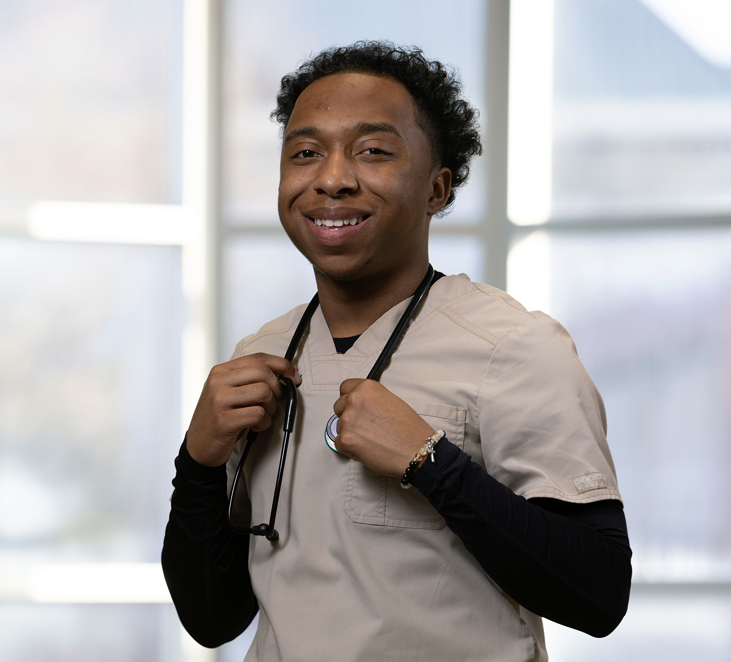 KSU Nursing DNP Student in scrubs