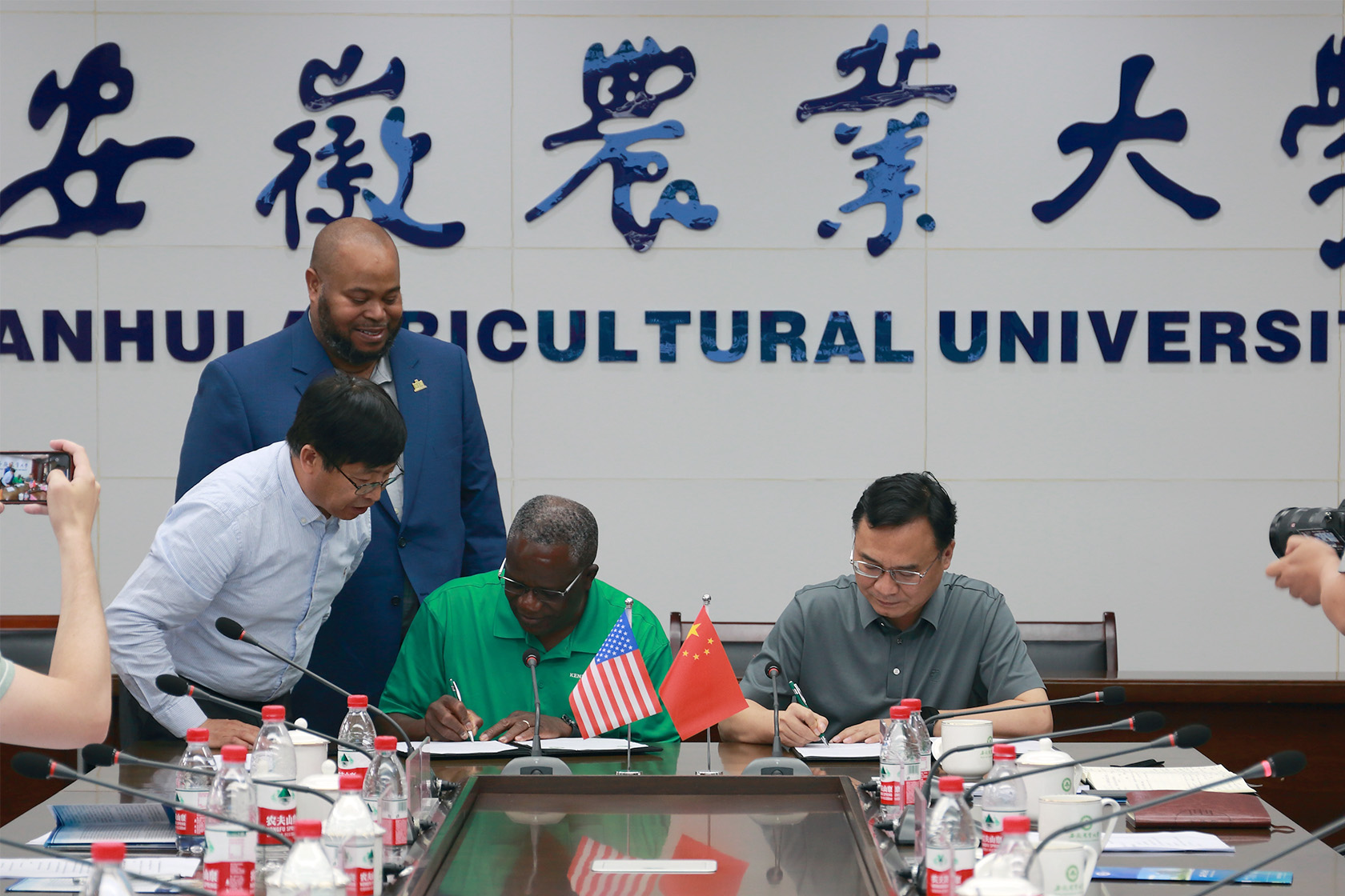 Dr. Akakpo signing international partnership papers