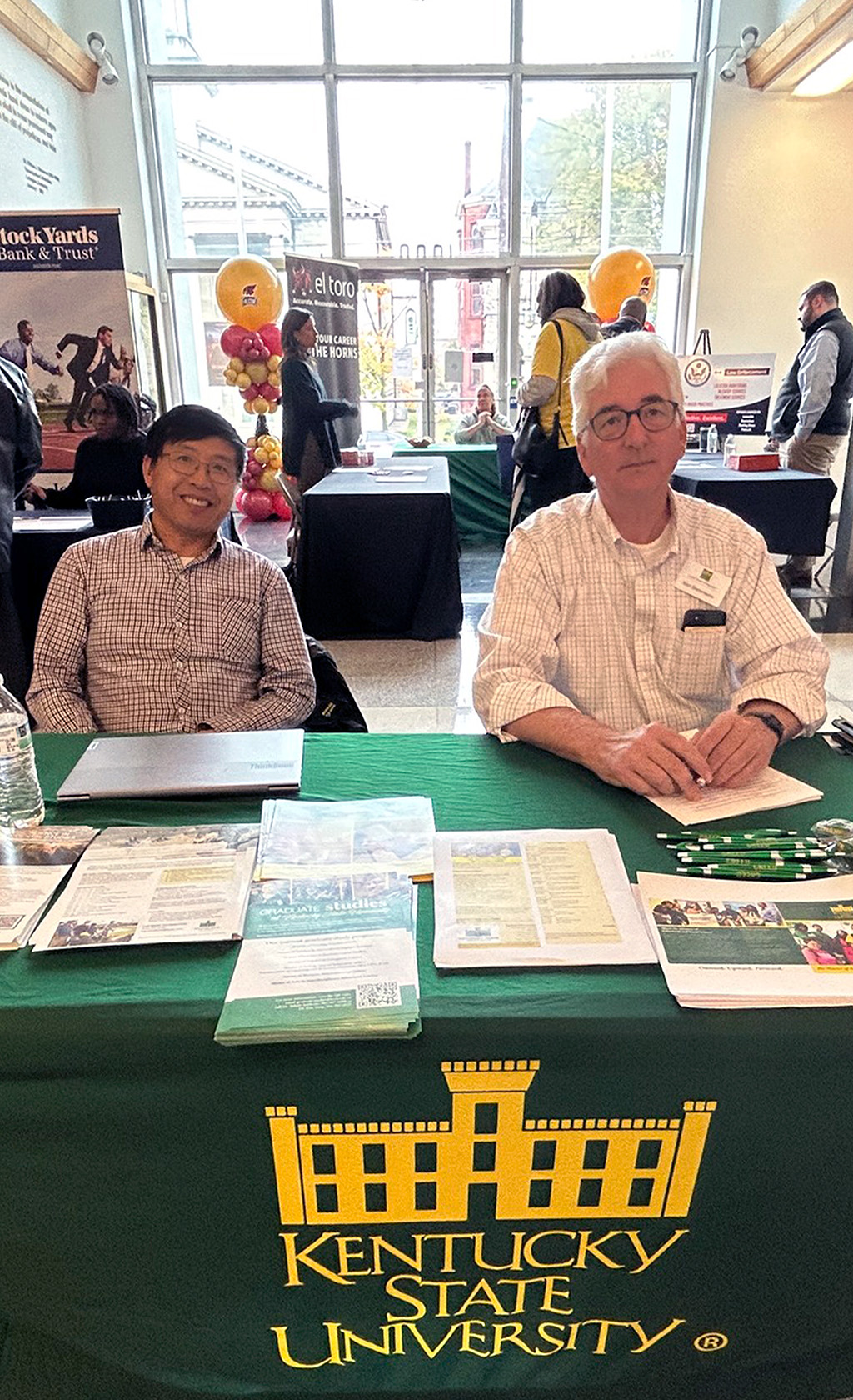 KSU Faculty and Staff behind table at conference
